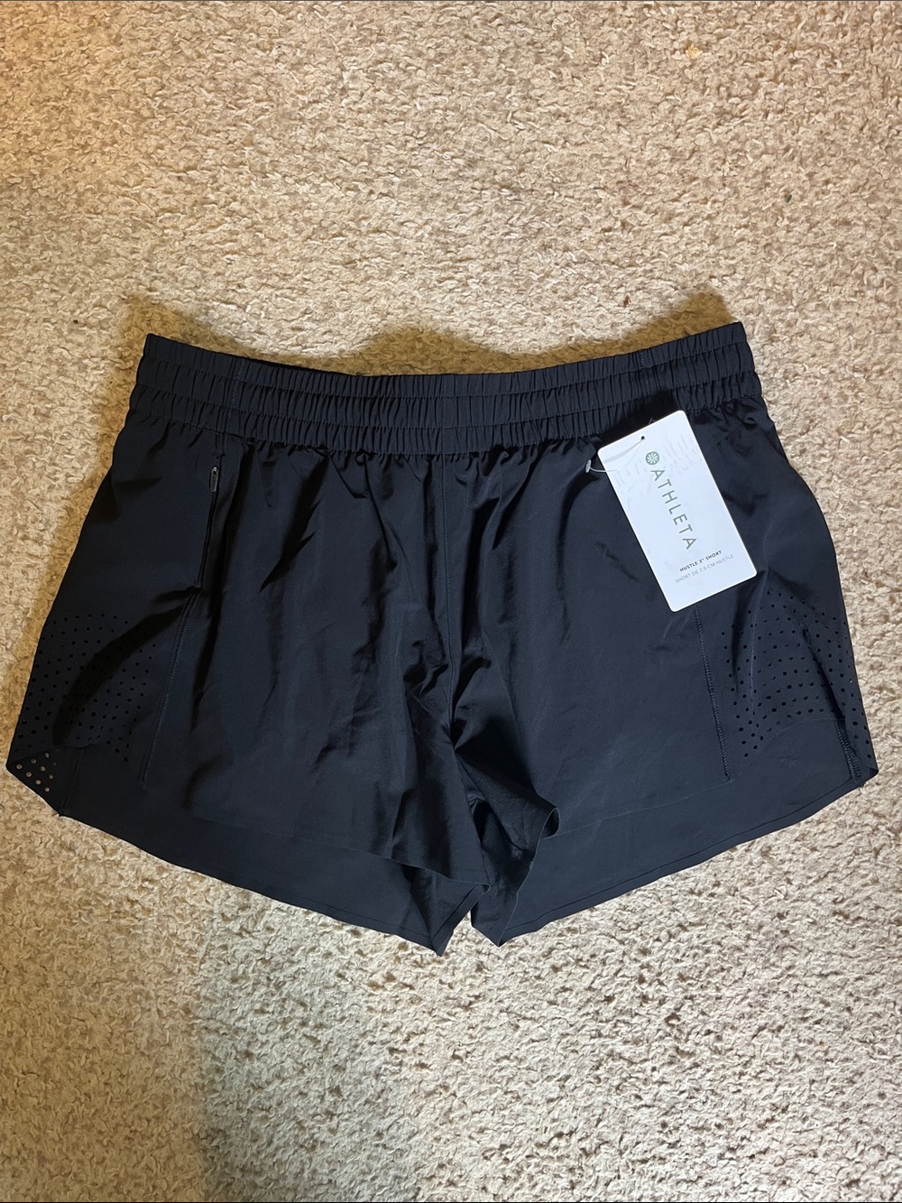 NWT women’s medium Athleta Hustle 3” shorts.